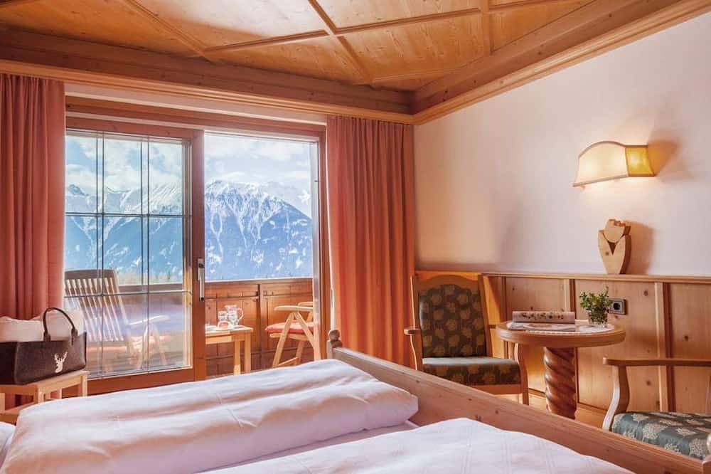 Doppelzimmer I mit Südbalkon inklusive Frühstück - Hotel Garni Lärchenhof Natur in Mösern, Telfs