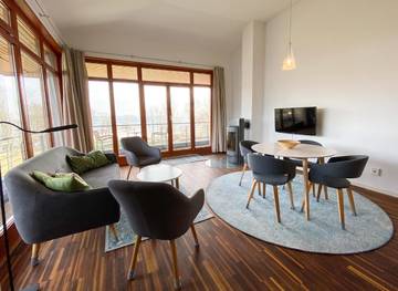 Ferienwohnung für 4 Personen, mit Balkon und Seeblick sowie Garten in Klink