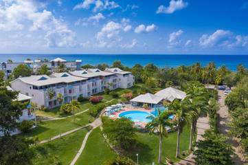 Hôtel pour 3 personnes, avec jardin et bassin pour enfant ainsi que vue et piscine dans Anse Corps de Garde