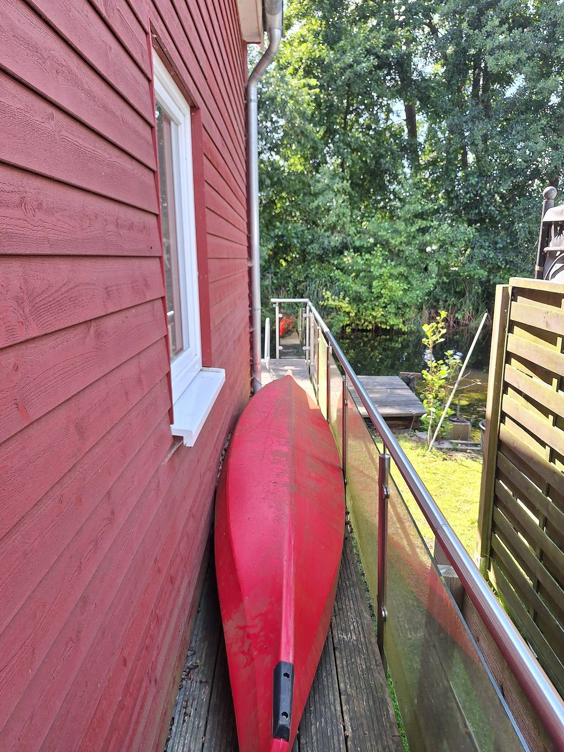 Ferienhaus 'Am Wasser, Bootshaus' mit privater Terrasse in Güstrow, Mecklenburgische Seenplatte