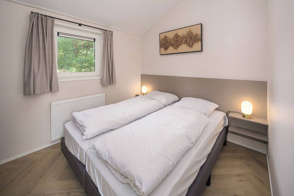 Die Doornenburg Lodge bietet eine komfortable Ferienunterkunft für 6 Personen mit modernen Annehmlichkeiten und einer eigenen Terrasse in der Veluwe. in Veluwe