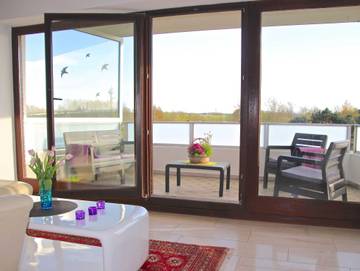 Ferienpark für 4 Personen, mit Ausblick und Garten sowie Seeblick, mit Haustier in Tossens