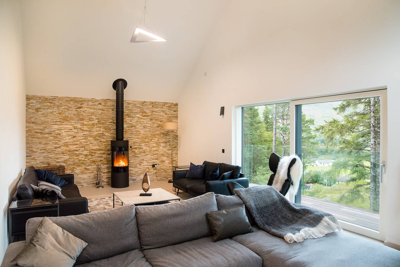 An Caisteal Lodge with cascading waterfall view in Stirling region