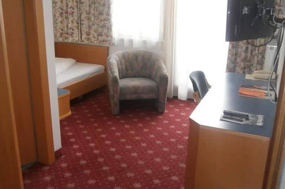 Einzelzimmer mit französischem Balkon - Das Kaltschmid - Familotel Tirol in Seefeld in Tirol, Innsbruck Land
