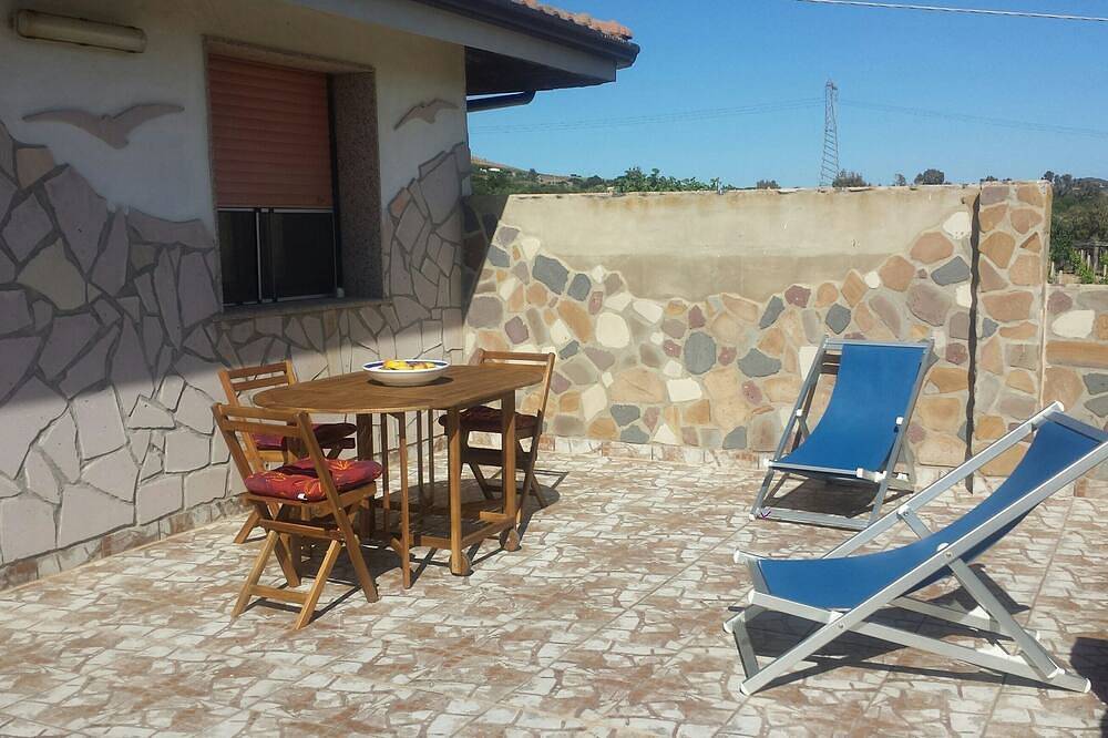 Appartamento intero, Sensazione di vacanza in una tranquilla zona appartamento uliveto con Wi-Fi! in Gonnesa, Iglesiente