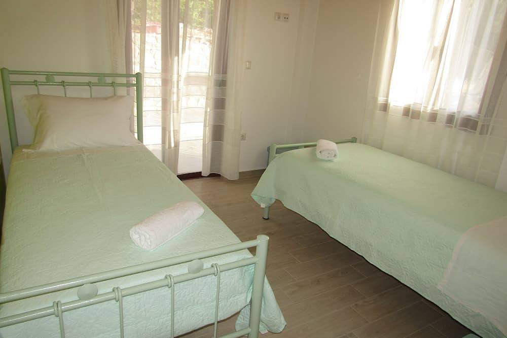 Stone house with pool and view to the sea in Achaia