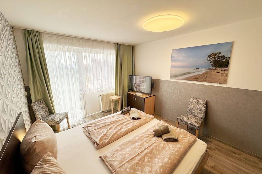 Ganze Wohnung, Wohnung 02 mit Terrasse und Boddenblick - Mr: Haus Inselperle mit Blick auf den in Alt Reddevitz, Mönchgut