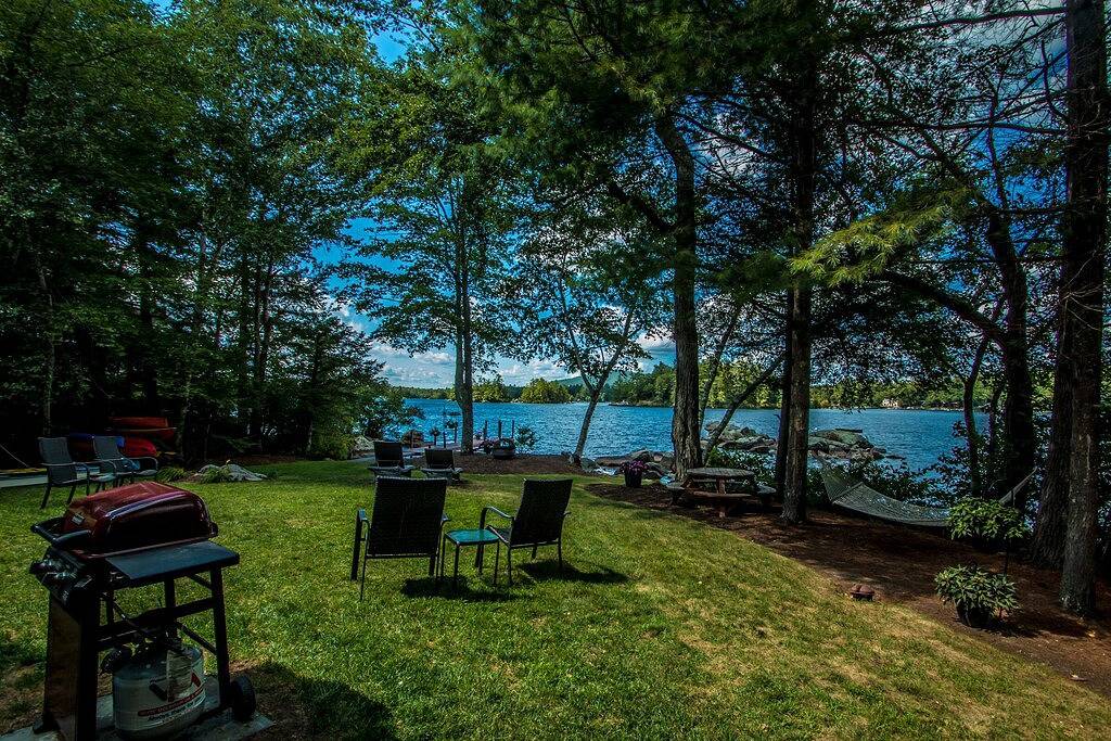 Waterfront home in Moultonborough with sandy beach and dock in Moultonborough, Lake Winnipesaukee