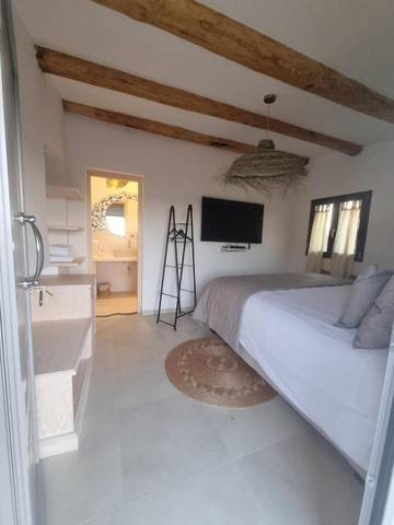 Cottage pour 2 personnes, avec terrasse et vue ainsi que jardin et piscine à Sant'Antonio di Gallura