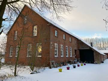 Bauernhaus für 4 Personen, mit Garten und Seeblick sowie Ausblick in Ostfriesland