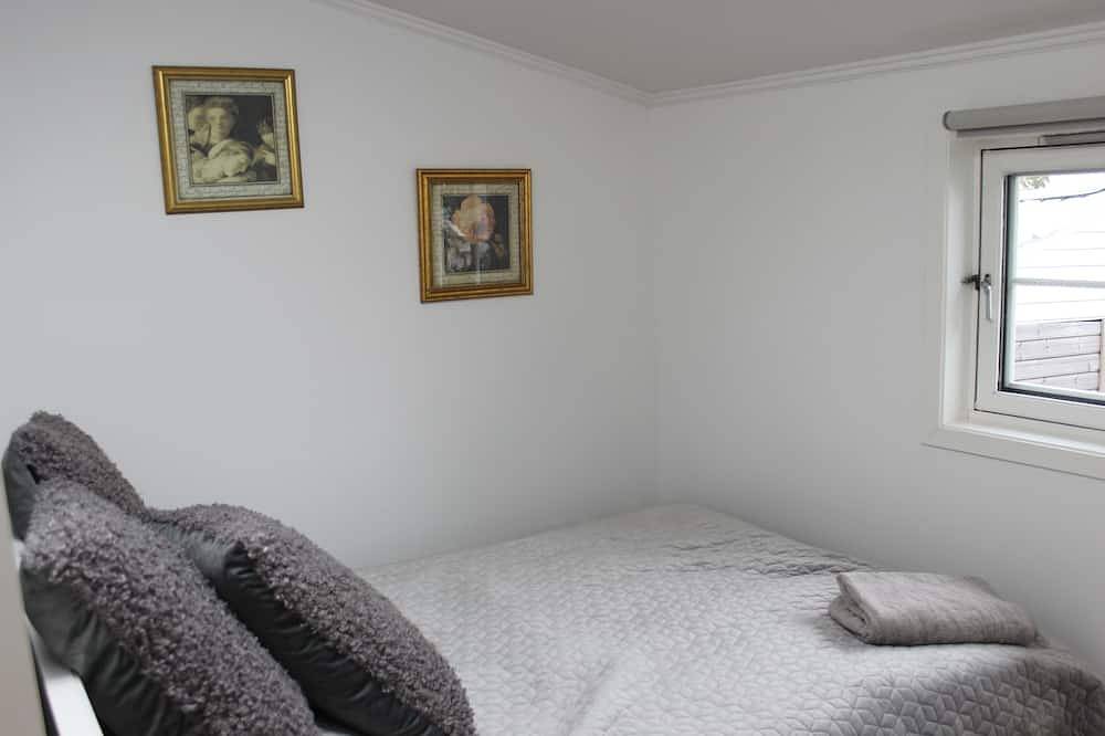 Et Koselig og Sentralt Townhouse med en Idyllisk Lille Hage for 2-5 Pers in Kristiansand