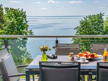 Ferienwohnung für 7 Personen, mit Garten und Seeblick sowie Sauna in Garz