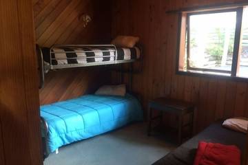 Location de vacances pour 8 personnes, avec jacuzzi ainsi que balcon et jardin dans Orewa