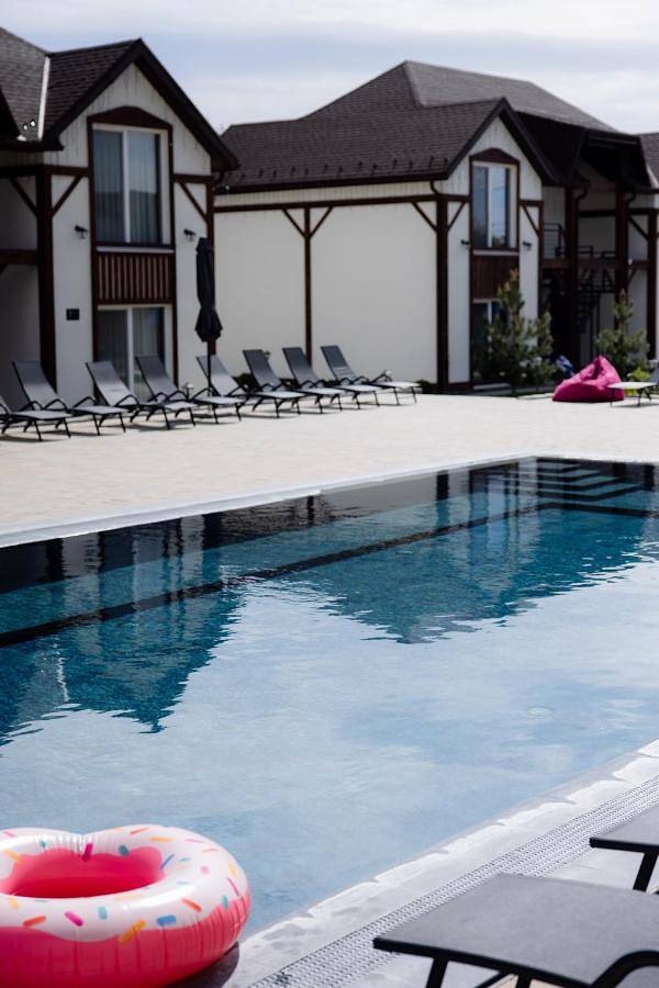 Appartement de vacances pour 4 personnes, avec Terrasse et Jardin ainsi que Bassin pour enfant et Piscine
