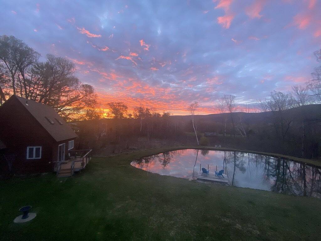 Home with a spring-fed pond and mountain view. in Green Mountain National Forest