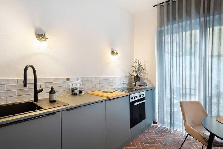 Apartamento entero, Apartamento "Altes Pfarrhaus - das Kelterhaus" con terraza compartida y Wi-Fi in Gleisweiler, Südliche Weinstraße
