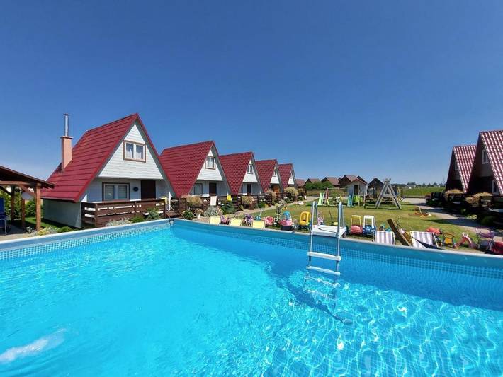 Ferienpark für 6 Personen, mit Ausblick und Pool sowie Garten und Terrasse, mit Haustier in Polnische Ostsee