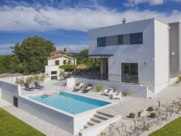 Villa pour 7 personnes, avec piscine et terrasse à Pomer