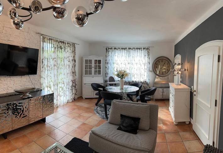 Ferienwohnung für 3 Personen, mit Terrasse und Garten sowie Ausblick