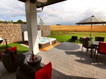 Ferienhaus für 7 Personen, mit Terrasse und Garten sowie Ausblick und Sauna, kinderfreundlich in Göhren-Lebbin