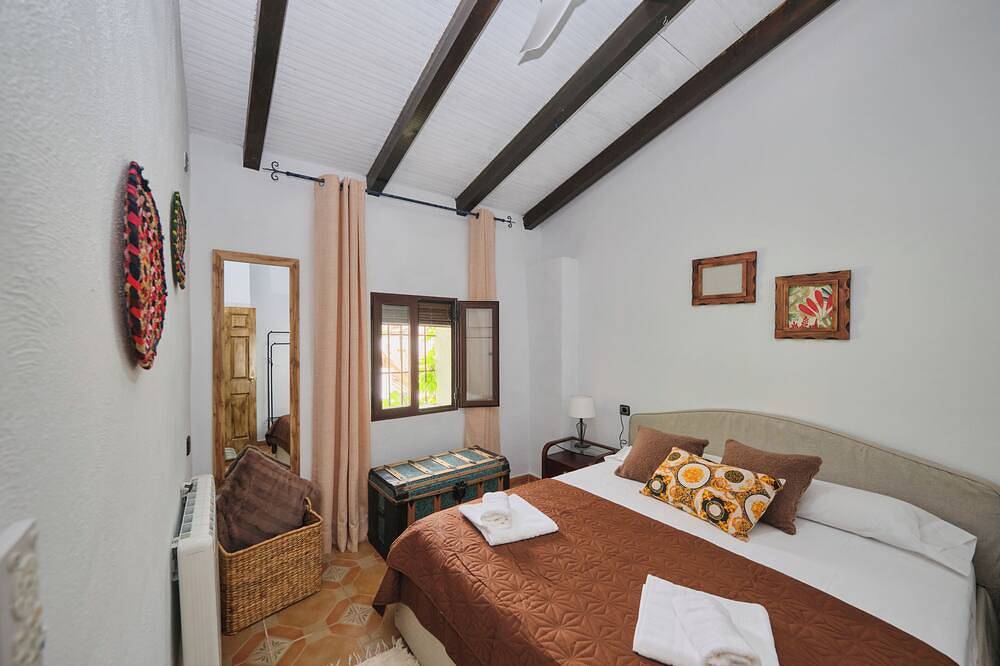 Luxury bedroom at Los Retamales with a queen-size bed, Casa Mathilda in Arenas del Rey, Cordillera Penibética