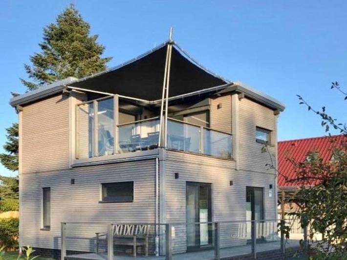 Ferienhaus mit Meerblick für 4 Personen, mit Balkon und Terrasse sowie Garten und Sauna in Südbrookmerland