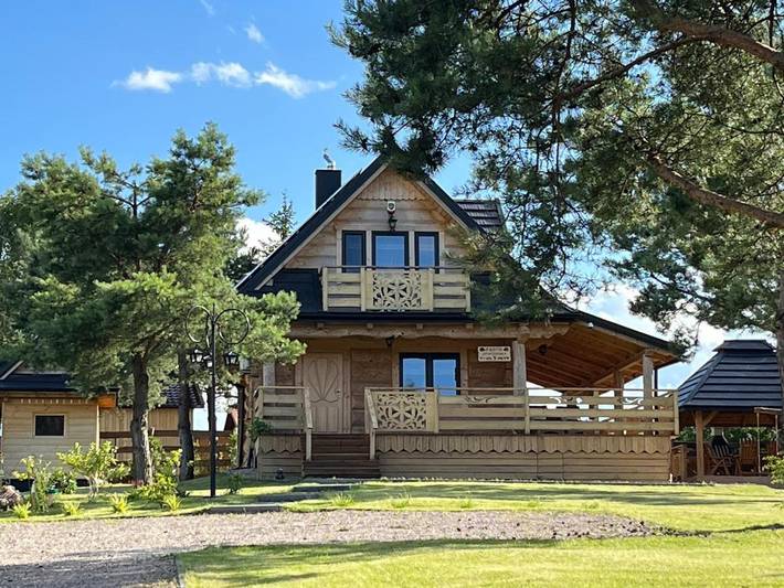 Dom dla 8 osób, z widok i sauna oraz widok na jezioro i ogród w Pasym