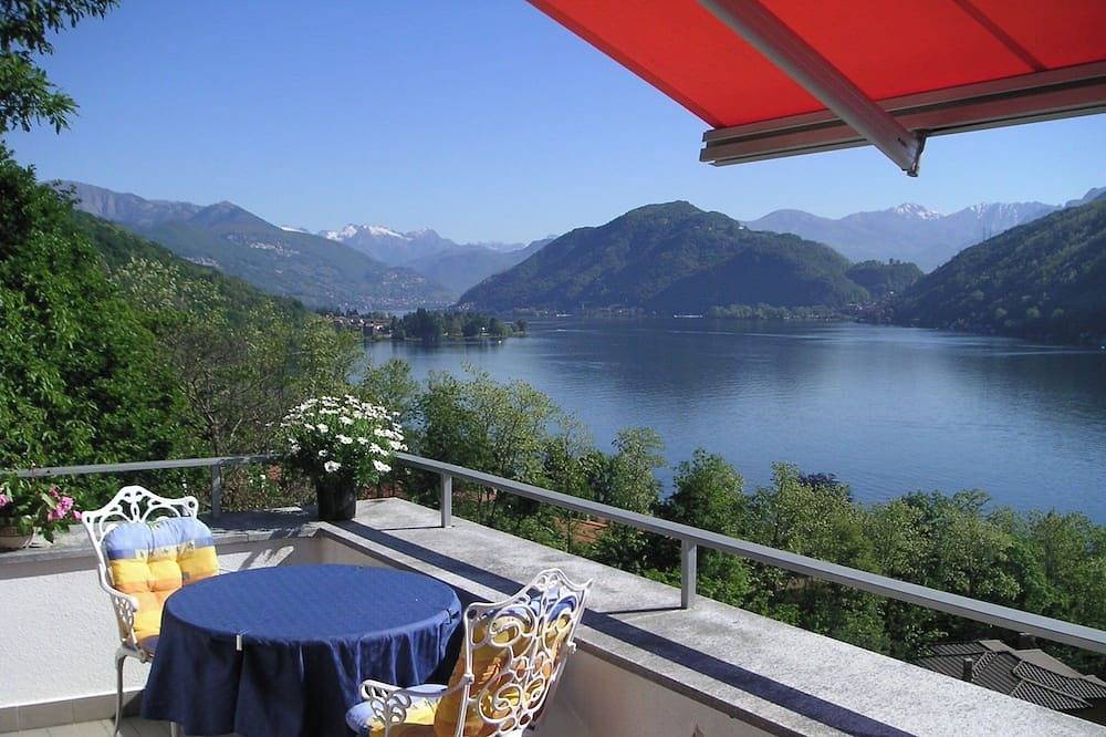 Ganze Wohnung, Ferienwohnung mit Panoramablick und Privatstrand in Villaggio Montelago, Brusimpiano Gemeinde