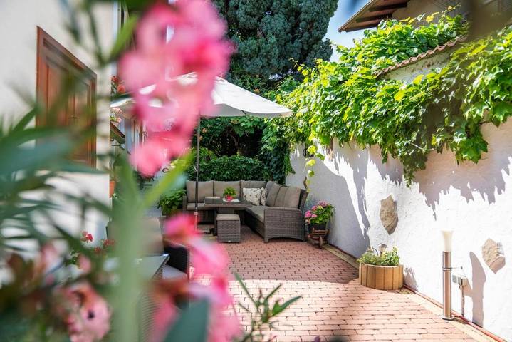 Ferienwohnung für 4 Personen, mit Balkon und Terrasse sowie Garten