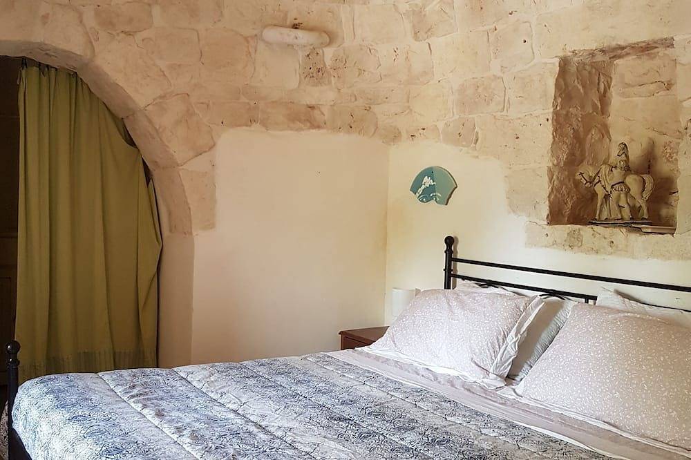 Trullo in an evergreen olive grove in Salento, Apulia. in Ceglie Messapica, Salento