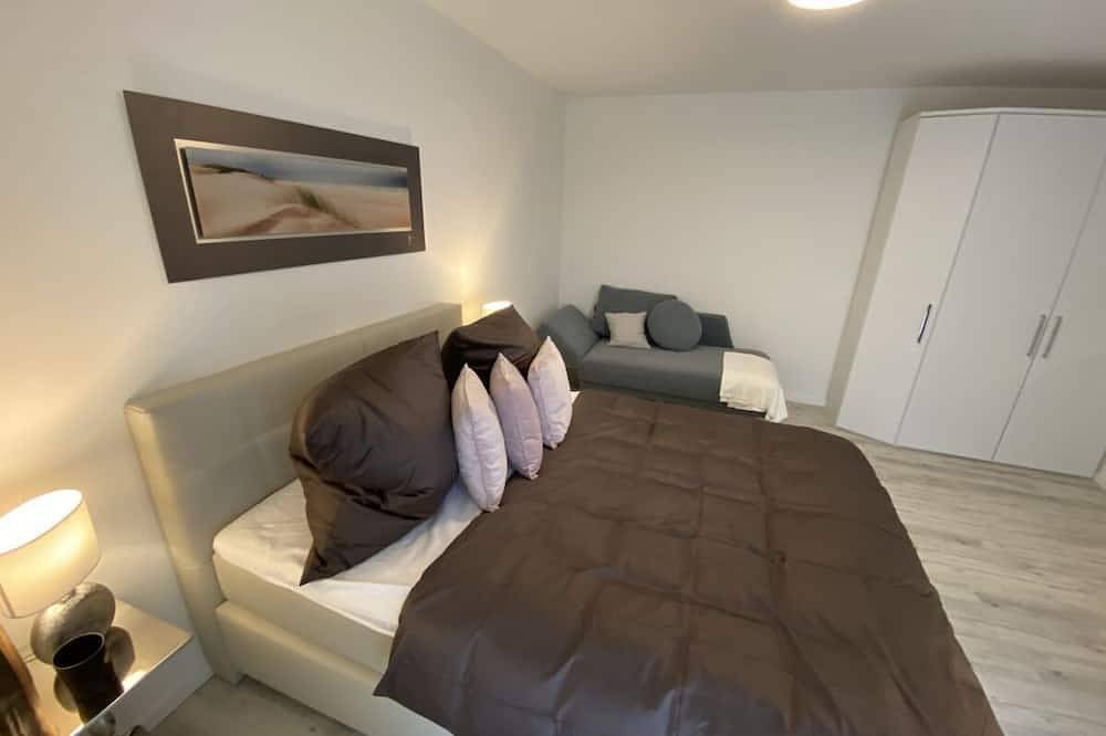 Ganze Wohnung, Komfortable Ferienwohnung mit Balkon, Sauna und Boddenblick in Lietzow, Bergen auf Rügen und Umgebung