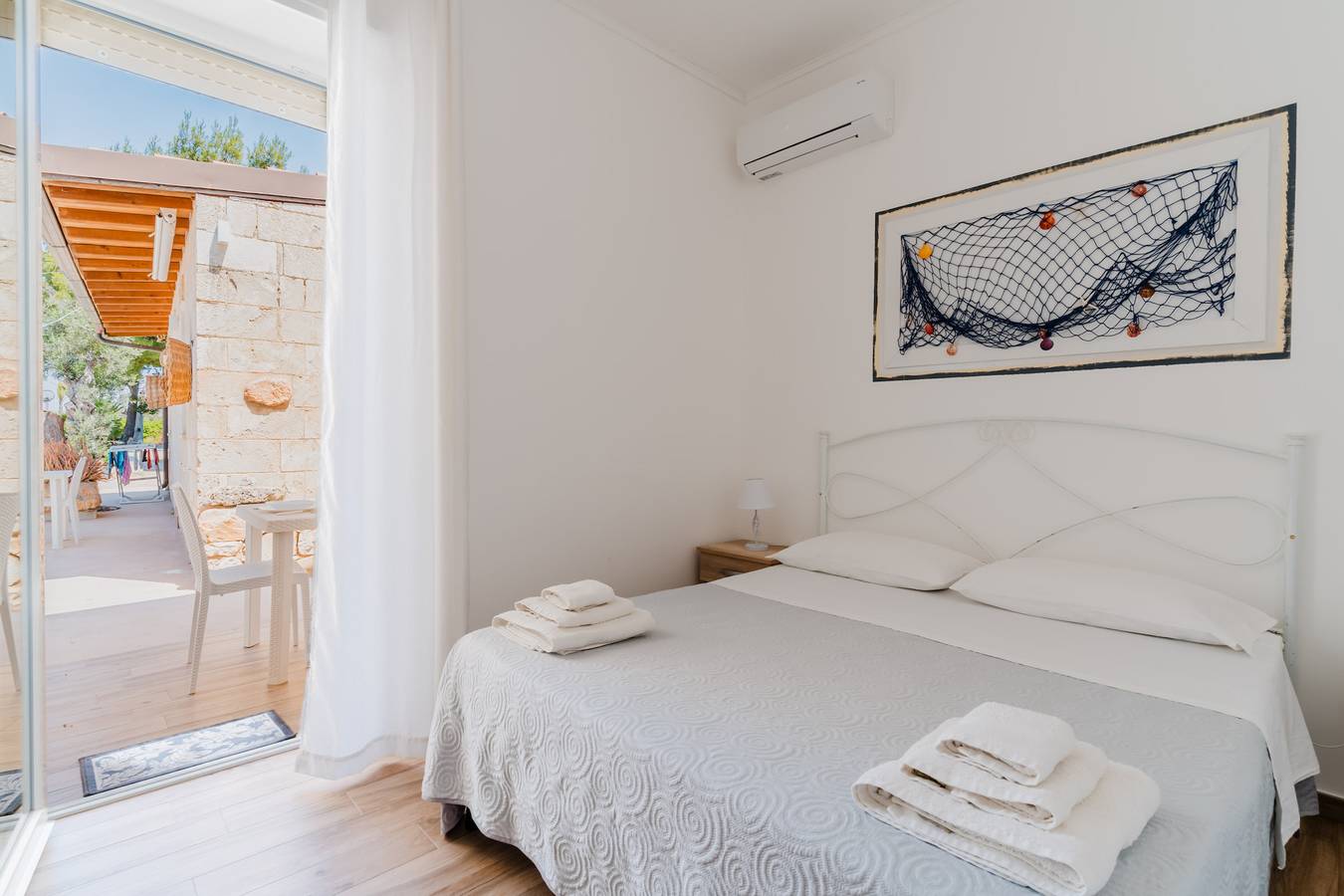 Chambre 'Camera Matrimoniale Con Bagno' avec jardin partagé, Wi-Fi et climatisation in Racale, Golfe de Tarente