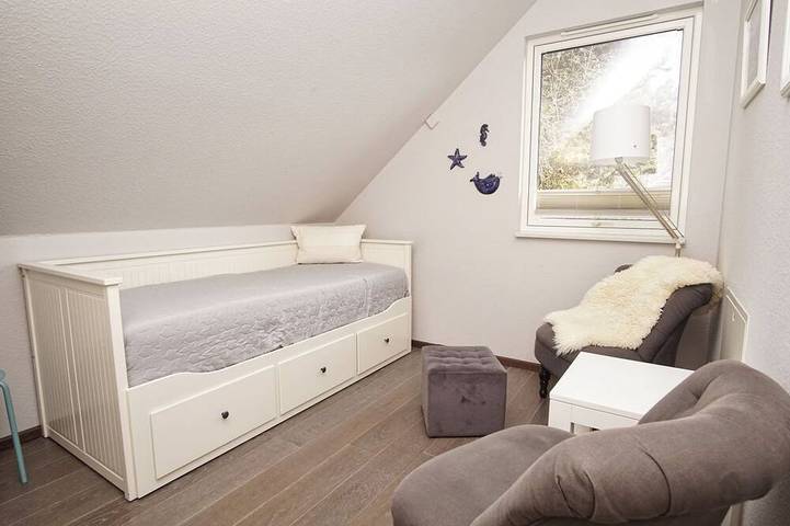 Haus Sternschnuppe—a cozy house with a fireplace, sauna, garden, and patio— in Wiek, Ruegen