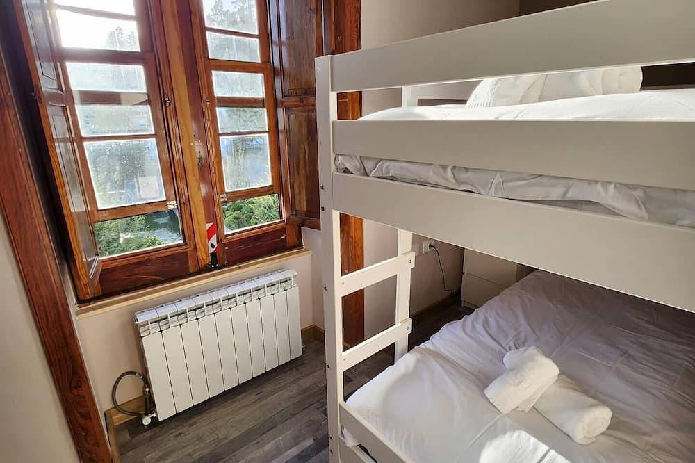 Apartamento entero, This room is a bunk room with two single bunk beds. The bathroom and showers are shared with the two other bunk rooms . The room has a great view of the village square. in Vilaflor de Chasna, Tenerife Sur