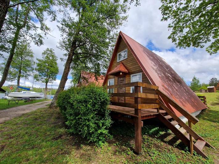 Domek letniskowy dla 4 osób, z widok i ogród oraz widok na jezioro i sauna w Bory Tucholskie
