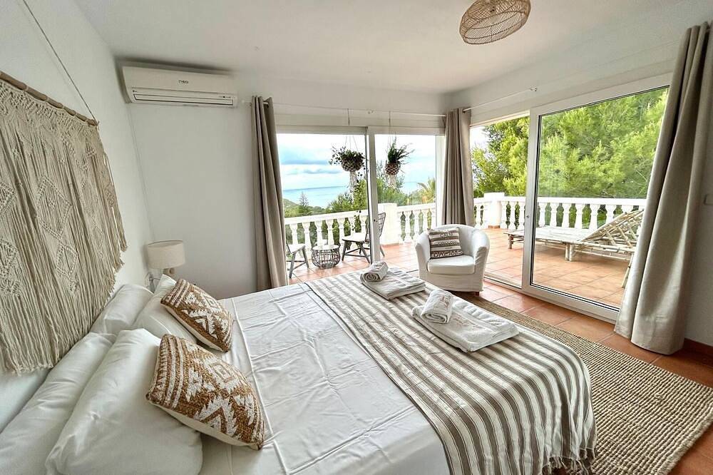 Stunning villa with sea & sunset views, in walking distance to Cala Salada beach in Cala Saladeta, Sant Antoni de Portmany