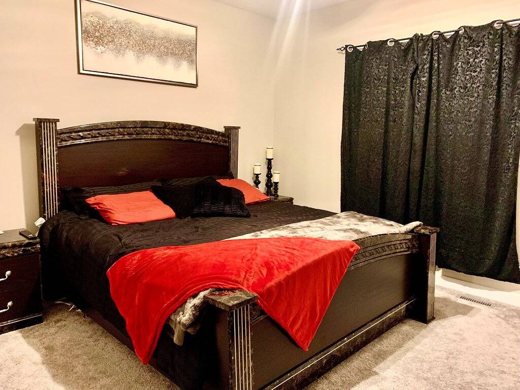 New executive home with hot tub and games area close to all amenities in Red Deer