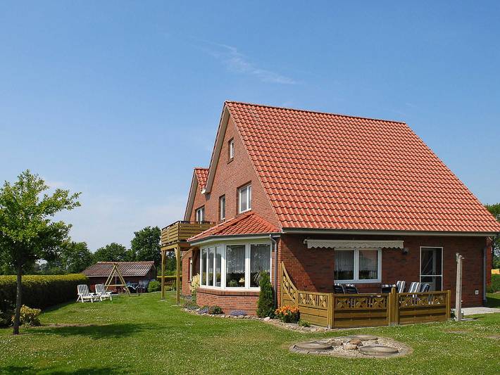 Ferienwohnung für 5 Personen, mit Garten und Balkon, kinderfreundlich in Dunum