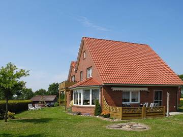 Ferienwohnung für 5 Personen, mit Garten und Balkon, kinderfreundlich in Dunum