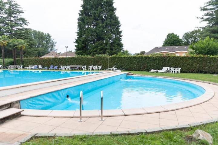 Ferienwohnung für 3 Personen, mit Garten und Kinderpool sowie Seeblick
