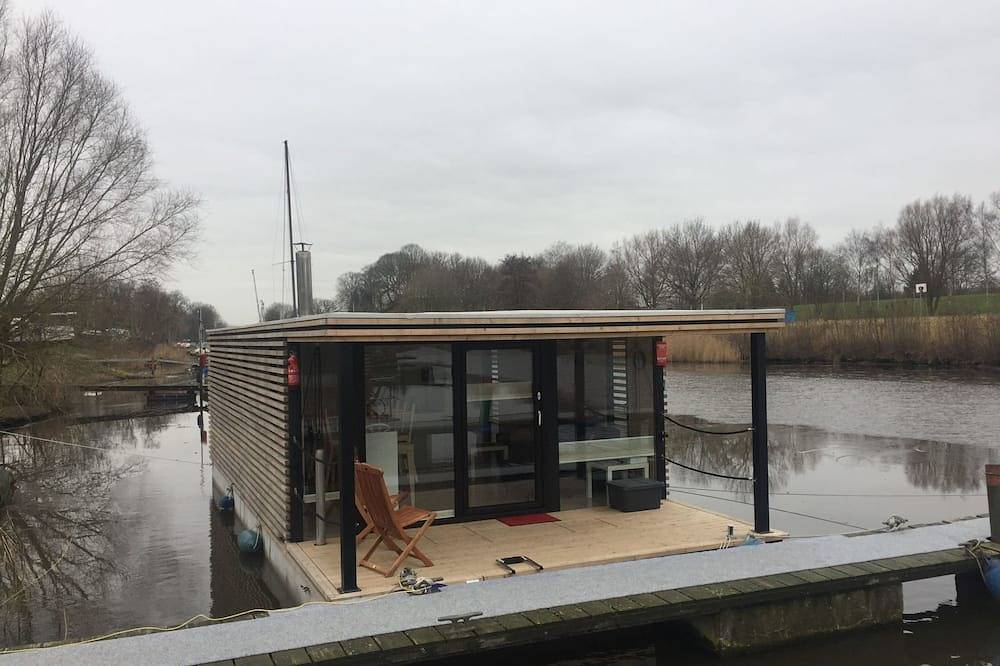 Ganze Wohnung, Hausboot für vier Personen mit Kamin und Terrasse in Wilhelmshaven, Südliche Nordseeküste