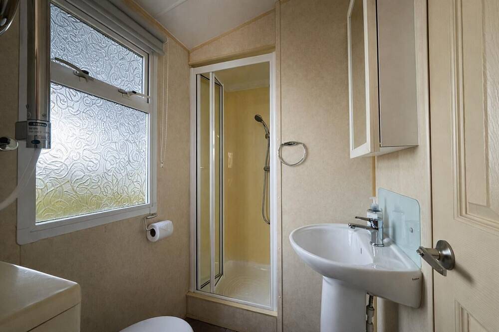 Caravan by the sea at California Cliffs Holiday Park in Norfolk in California (Great Yarmouth), Great Yarmouth