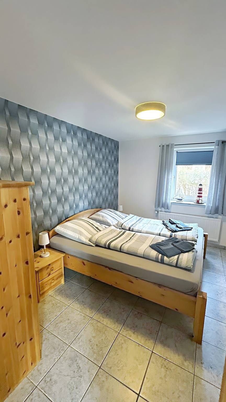 Apartamento entero, Apartamento 'Ferienwohnung Uthlande' con terraza compartida, jardín compartido y Wi-Fi in Langeneß, Hallig
