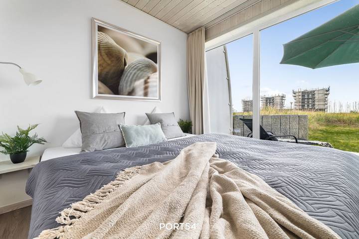 Ferienhaus für 4 Personen, mit Balkon und Terrasse sowie Garten und Sauna an der Kieler Bucht