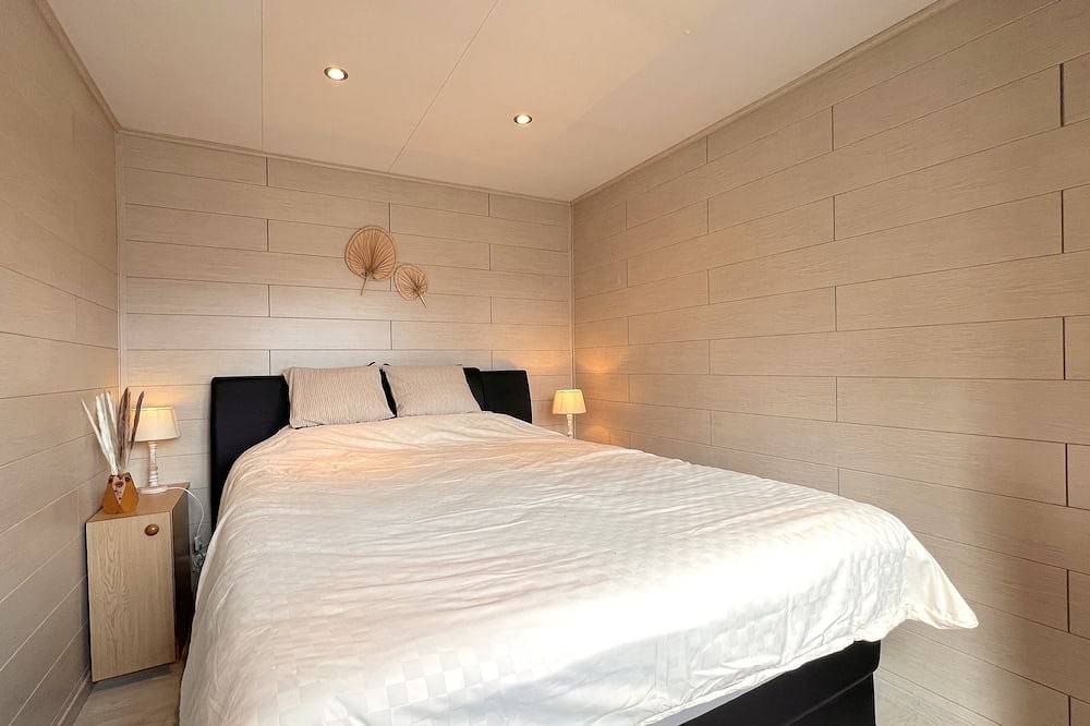 Gezellig ingericht chalet aan het water in Geel, Antwerpen en omgeving