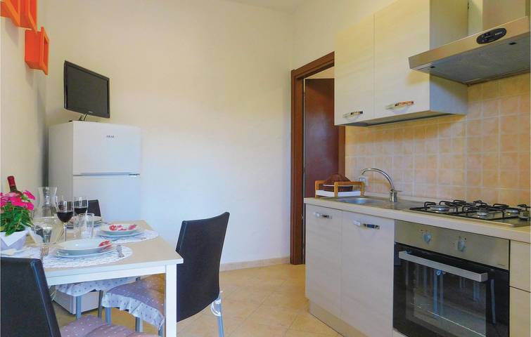 Appartement de vacances entier, Retraite au bord de la piscine : Appartement confortable avec jardin et Internet in Gonnesa, Iglesiente