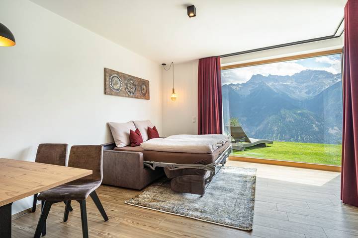Appartement entier, Appartement de vacances "Paflur Lodges Abendrot" avec vue sur la montagne, terrasse privée et Wi-Fi in Tanas, Laas (Italie)