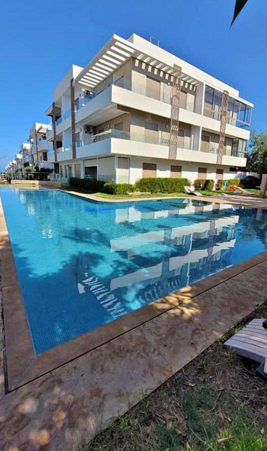 Appartement de vacances pour 4 personnes, avec jardin ainsi que balcon et piscine