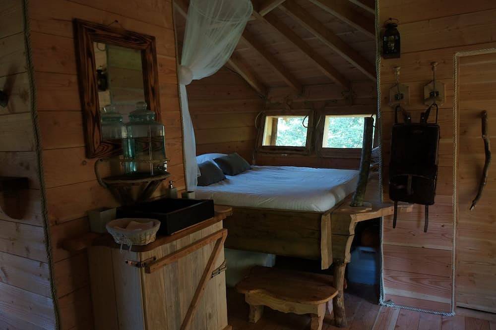 Cabane Méïzou des Puys-Cabaña de madera-Familiar-Baño privado-Vista al bosque in La Tour-d'Auvergne, Parque Natural Regional Volcans d'Auvergne