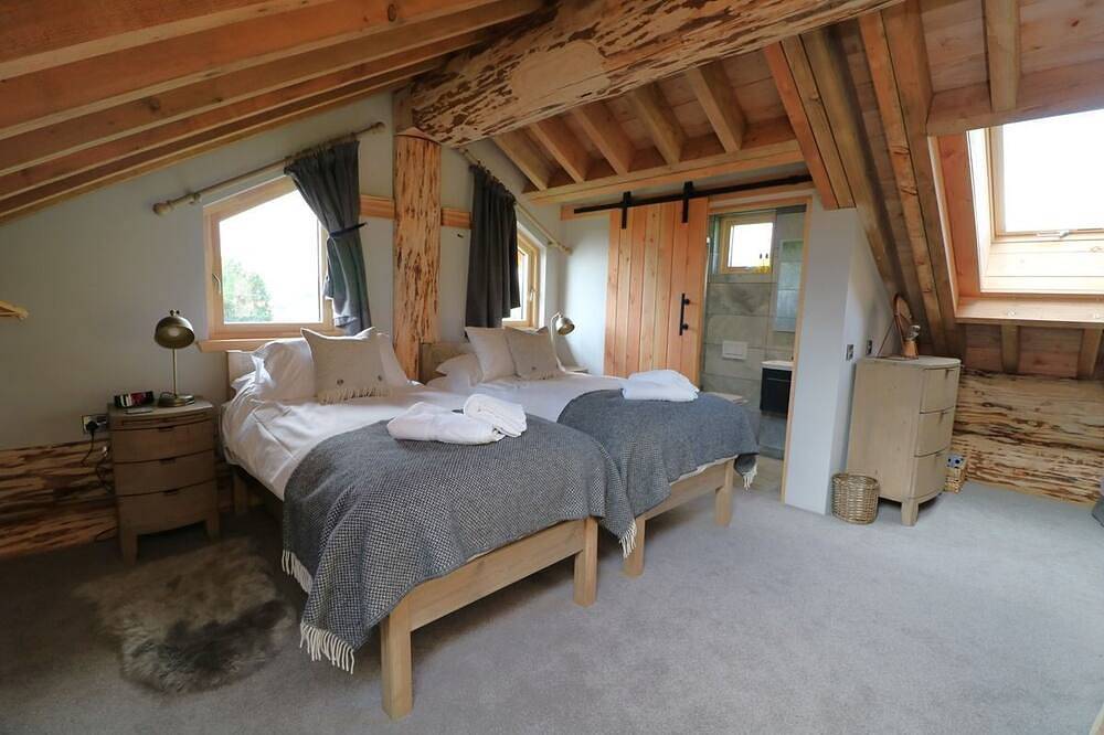 A fairy tale log cabin hand crafted from huge Douglas Fir trees. This rustic luxury cabin has oodles in Melrose, Scottish Borders